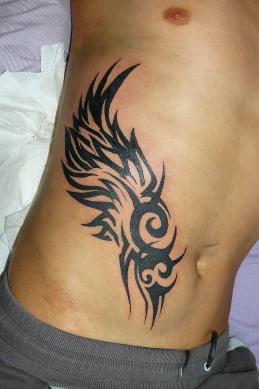 tribal tattoos on shoulder blade. Location: Right Shoulder Blade