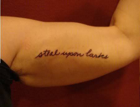 the inside of her arm. The tattoo spells out her husband's name, Seal.