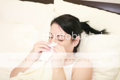 Woman sneezing influenza